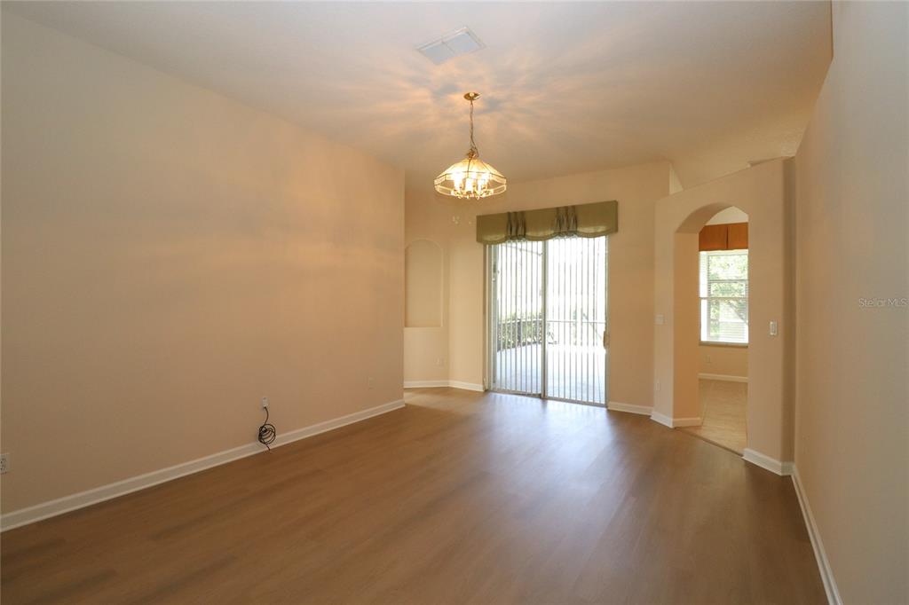 605 Cheviot Court Apopka, FL 32712 - Photo 14 of 32 an empty room with wooden floor and windows