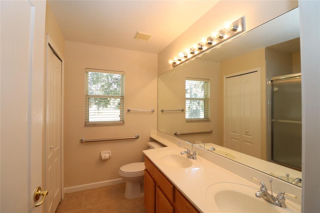 605 Cheviot Court Apopka, FL 32712 - Photo 26 of 32 a bathroom with a granite countertop sink toilet and shower