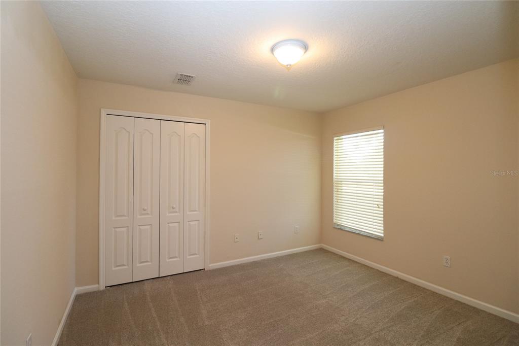 605 Cheviot Court Apopka, FL 32712 - Photo 27 of 32 an empty room with windows