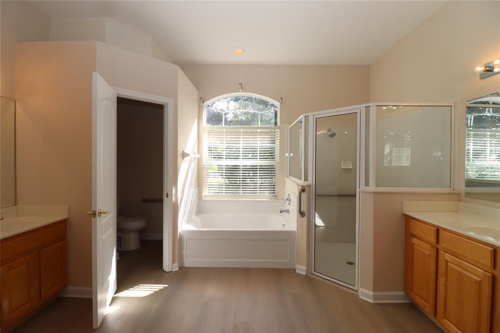 605 Cheviot Court Apopka, FL 32712 - Photo 4 of 32 a bathroom with a tub shower and sink