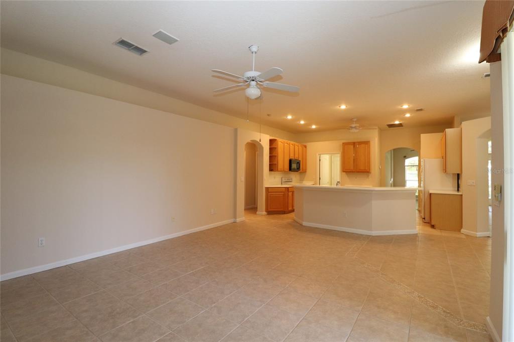 605 Cheviot Court Apopka, FL 32712 - Photo 9 of 32 a view of an empty room with a kitchen