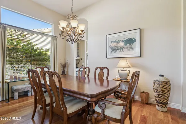 a view of a workspace with furniture and a book shelf
