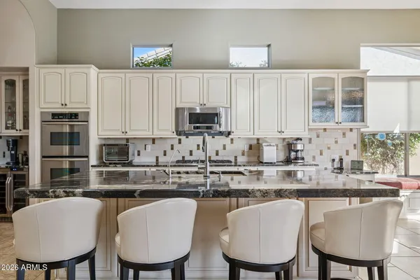 a view of a livingroom with furniture and a flat screen tv