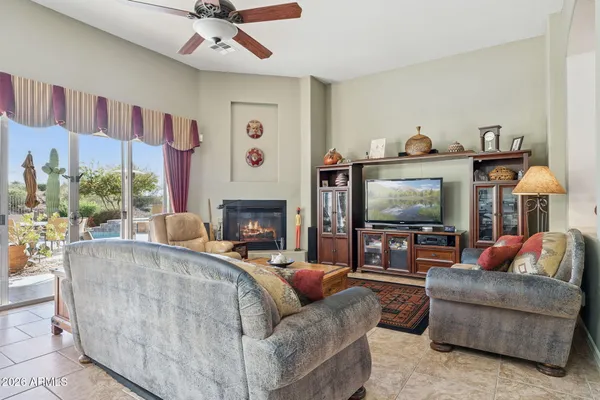 a bedroom with two beds and a large window