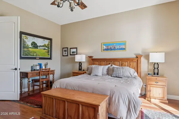 a front view of a house with a yard and mountain view
