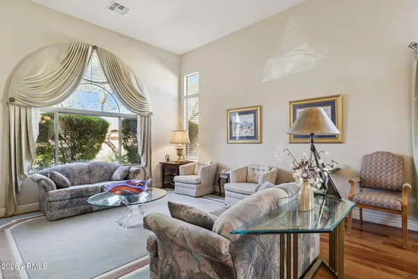 a bedroom with a bed and a lamp on table