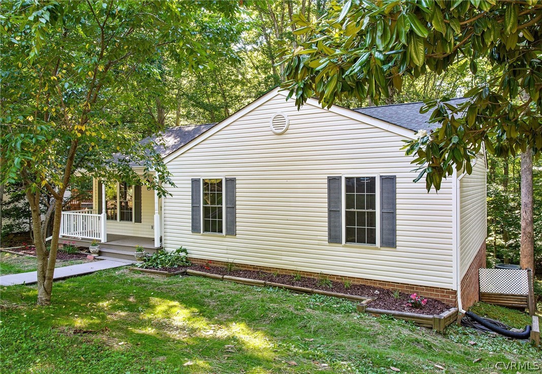 7560 Valencia Road Chesterfield, VA 23832 - Photo 21 of 26 a front view of a house with a garden