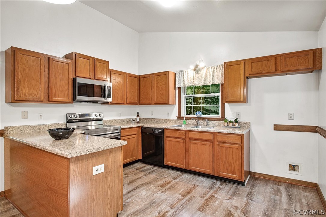 7560 Valencia Road Chesterfield, VA 23832 - Photo 3 of 26 a kitchen with stainless steel appliances granite countertop a sink stove and microwave