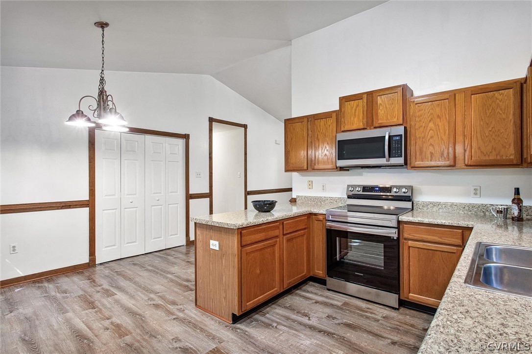 7560 Valencia Road Chesterfield, VA 23832 - Photo 5 of 26 a kitchen with stainless steel appliances granite countertop a sink stove and refrigerator
