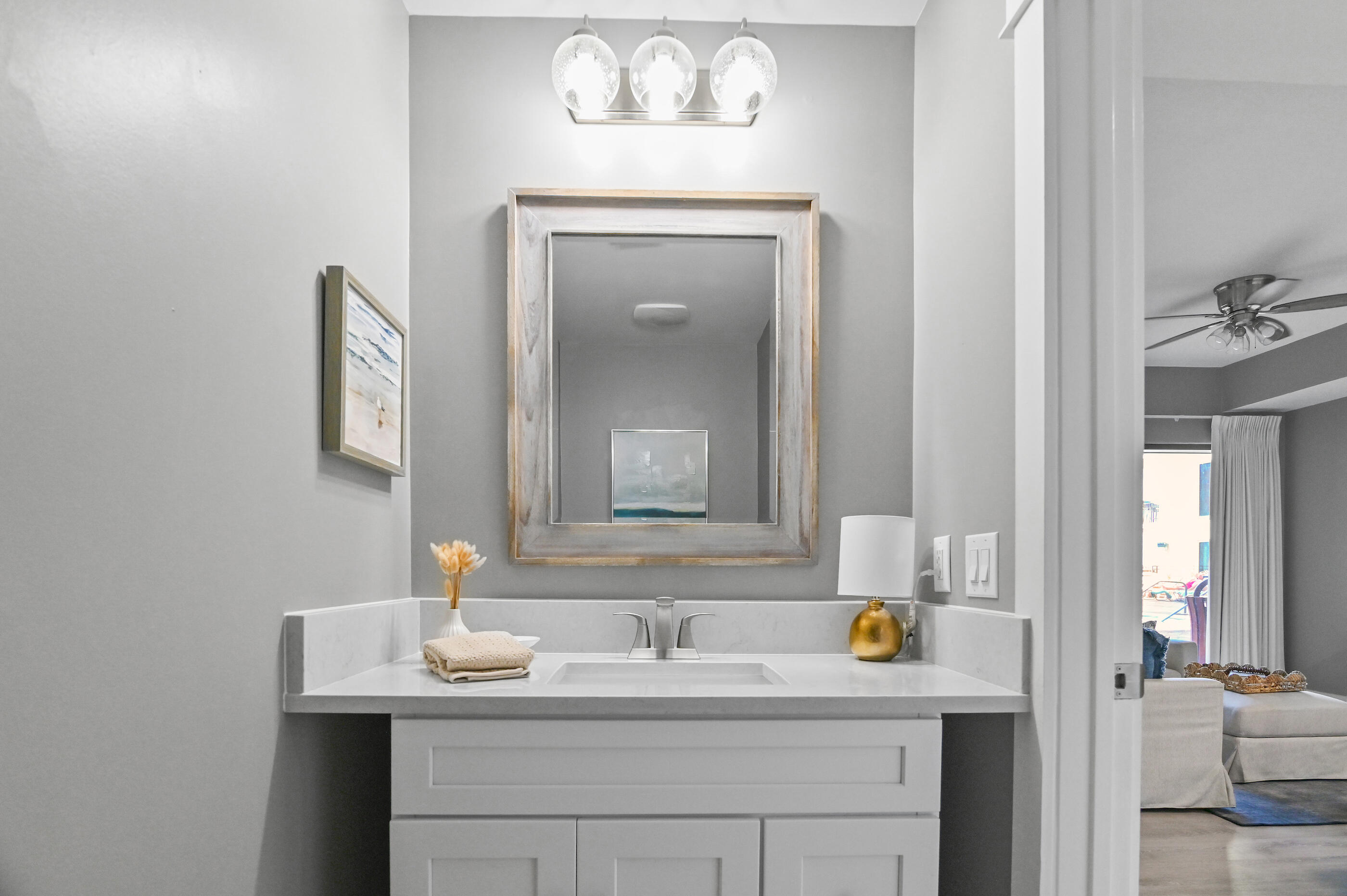 15100 Front Beach Road, Unit 424 Panama City Beach, FL 32413 - Photo 11 of 30 a bathroom with a sink and a mirror