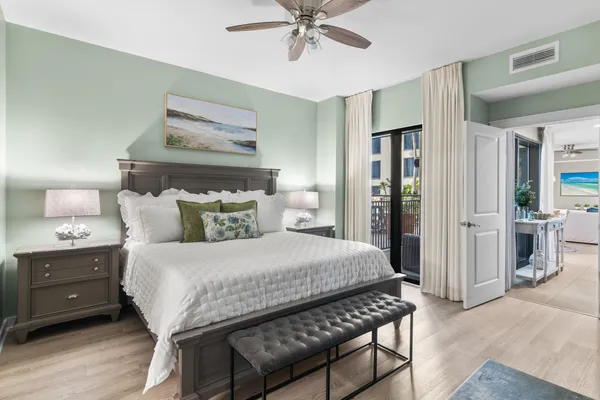 a bedroom with a bed and a chandelier