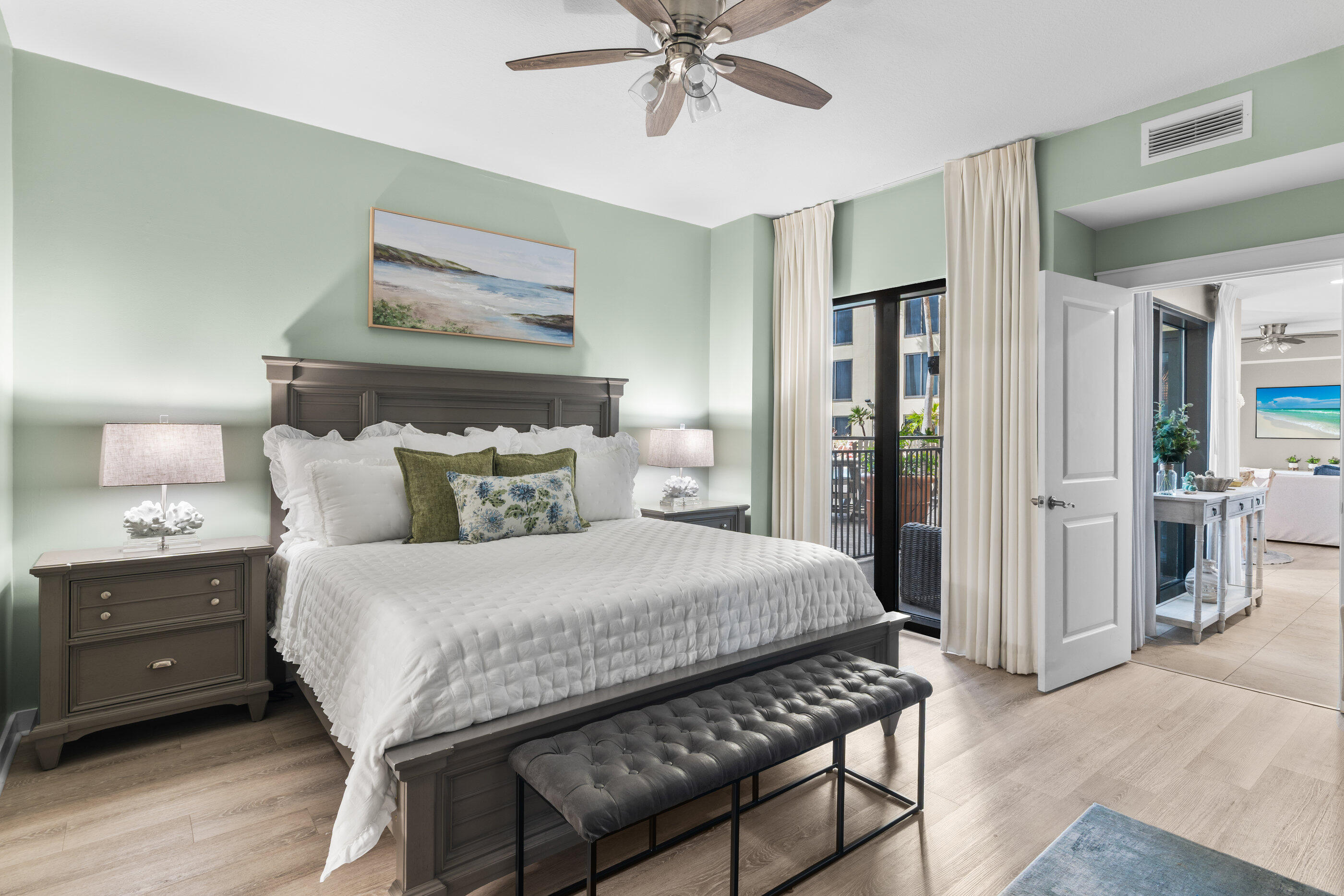 15100 Front Beach Road, Unit 424 Panama City Beach, FL 32413 - Photo 12 of 30 a bedroom with a bed and a chandelier