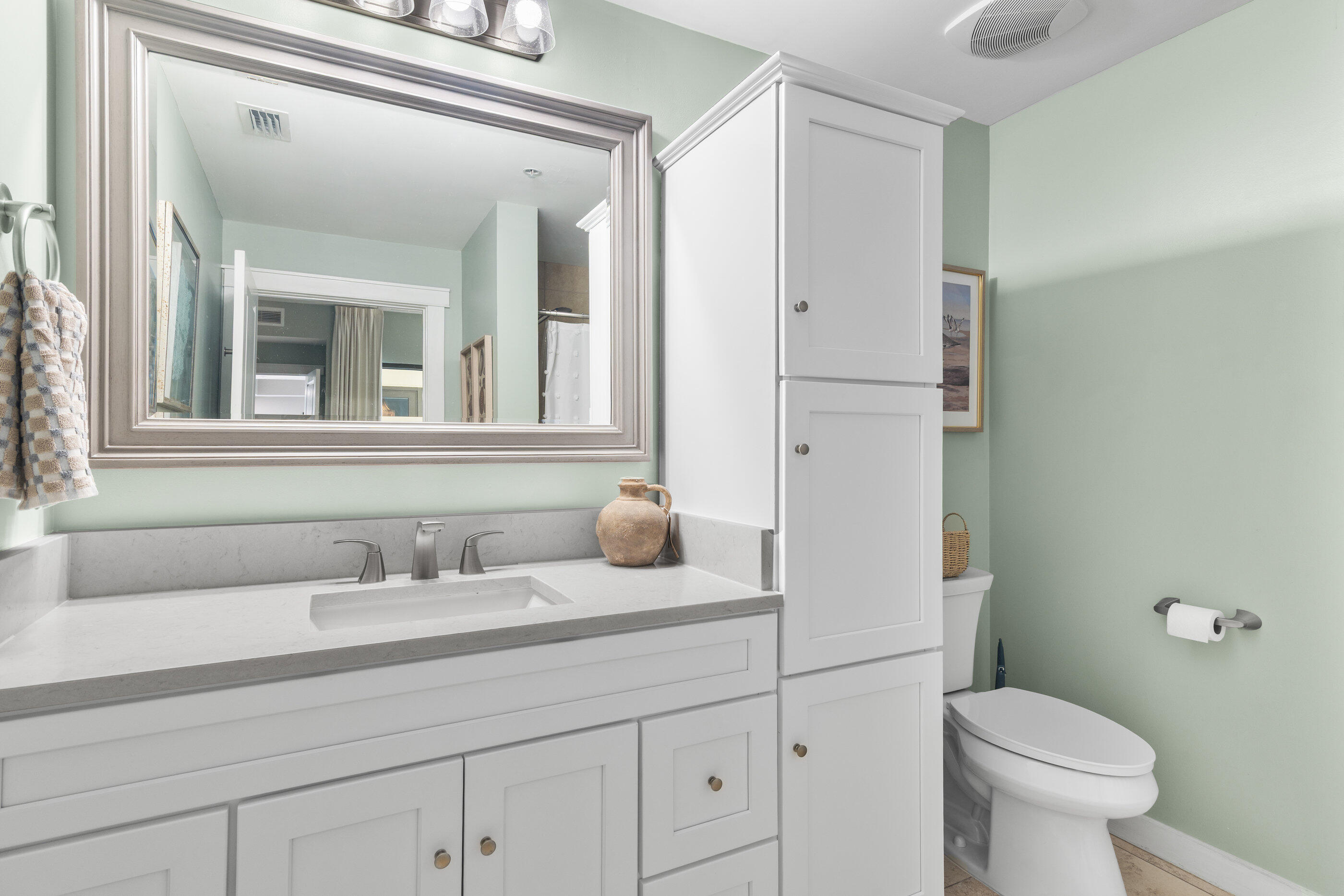 15100 Front Beach Road, Unit 424 Panama City Beach, FL 32413 - Photo 15 of 30 a bathroom with a sink and a toilet