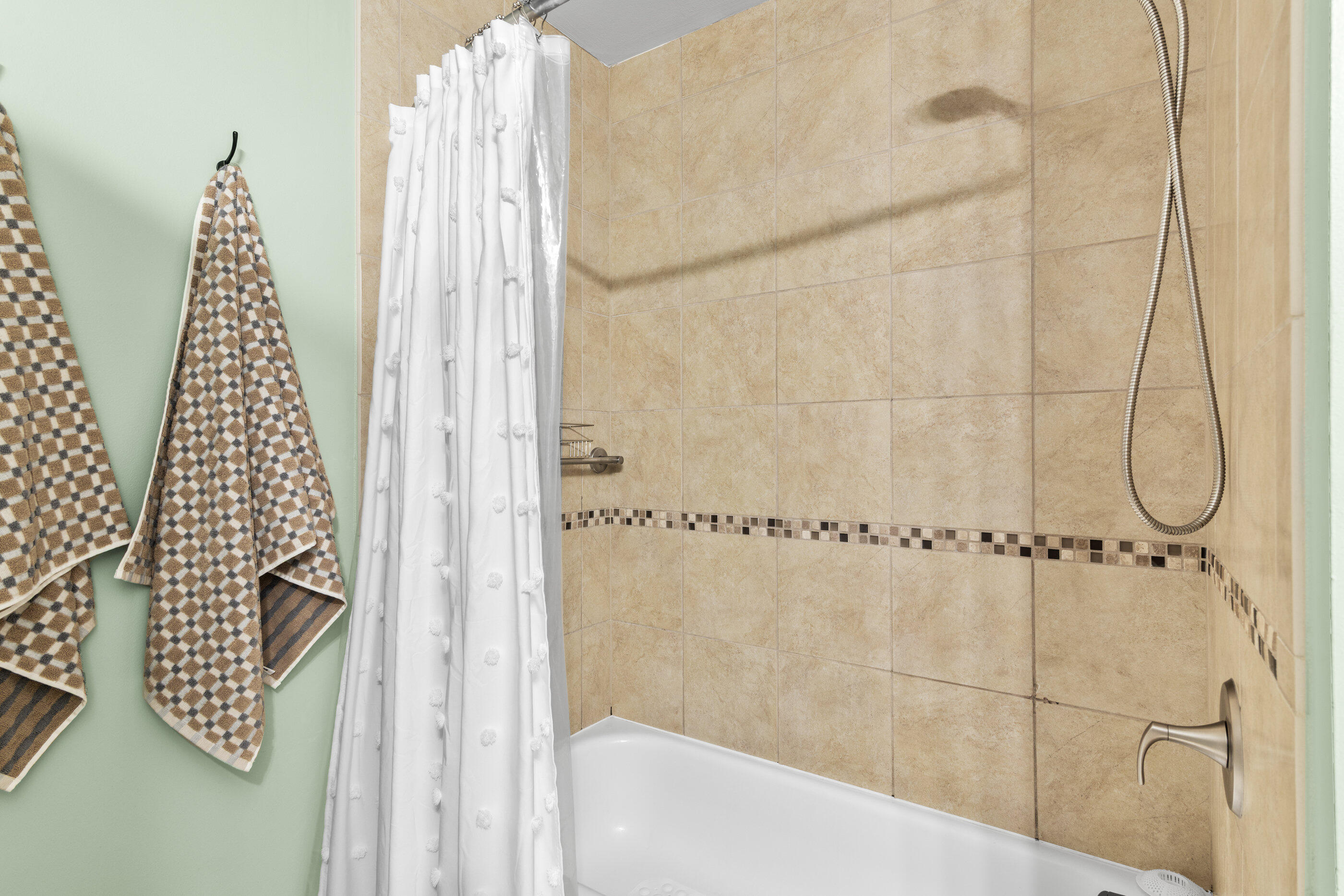 15100 Front Beach Road, Unit 424 Panama City Beach, FL 32413 - Photo 16 of 30 a bathroom with a bathtub