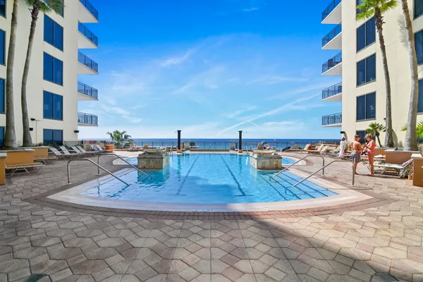 a view of a swimming pool with a lounge chair
