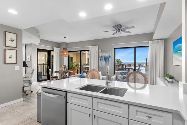 a kitchen with a sink and large window