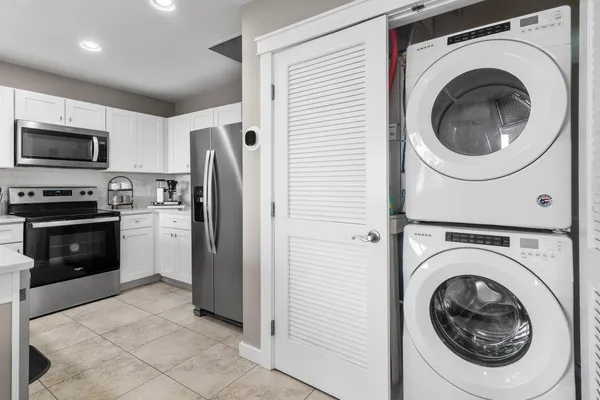 a view of a kitchen with washer and dryer