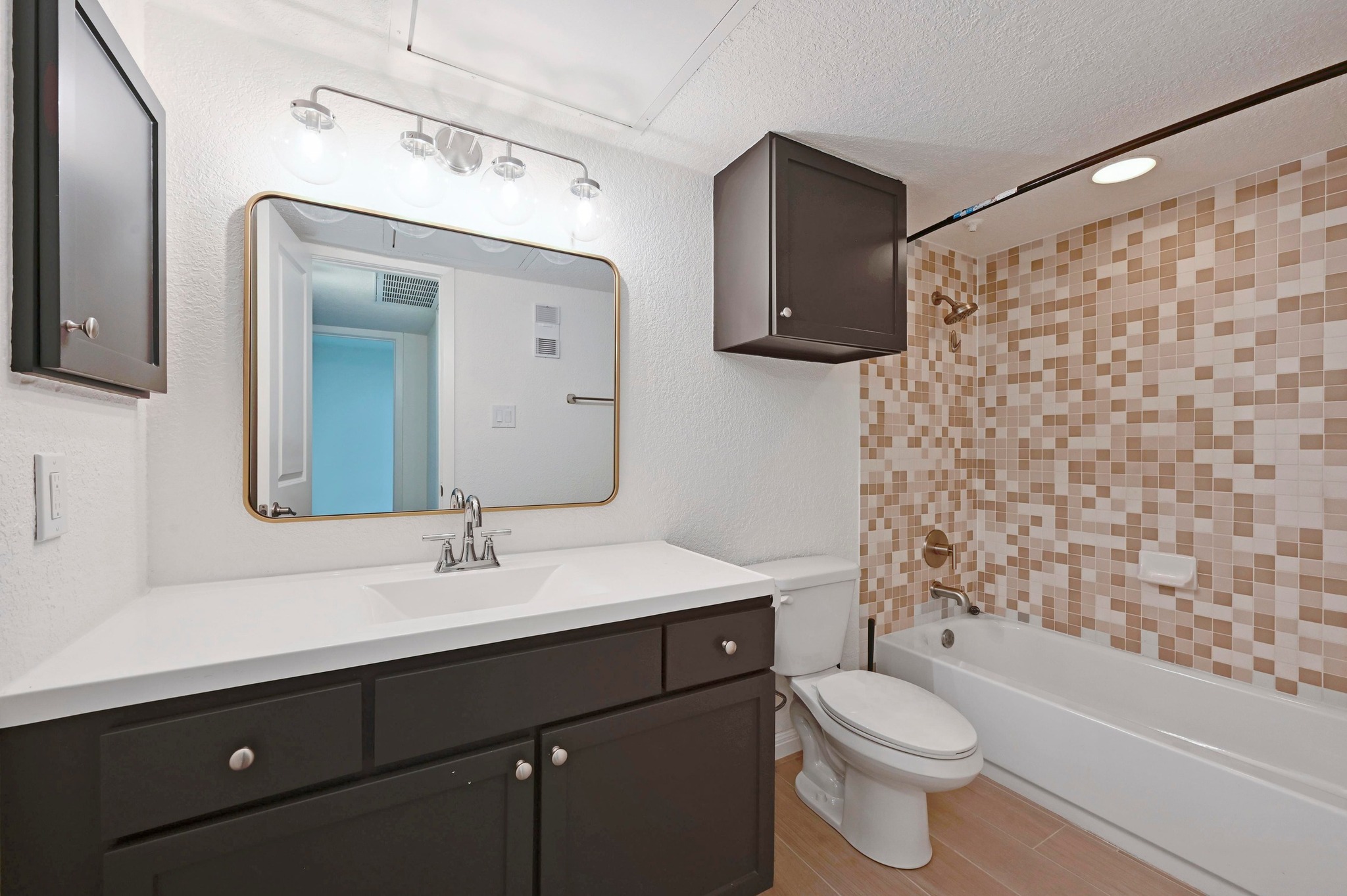 3204 Menchaca Road, Unit 212 Austin, TX 78704 - Photo 21 of 22 a bathroom with a sink toilet vanity and shower