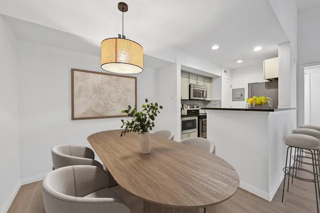 a dining room with furniture and window