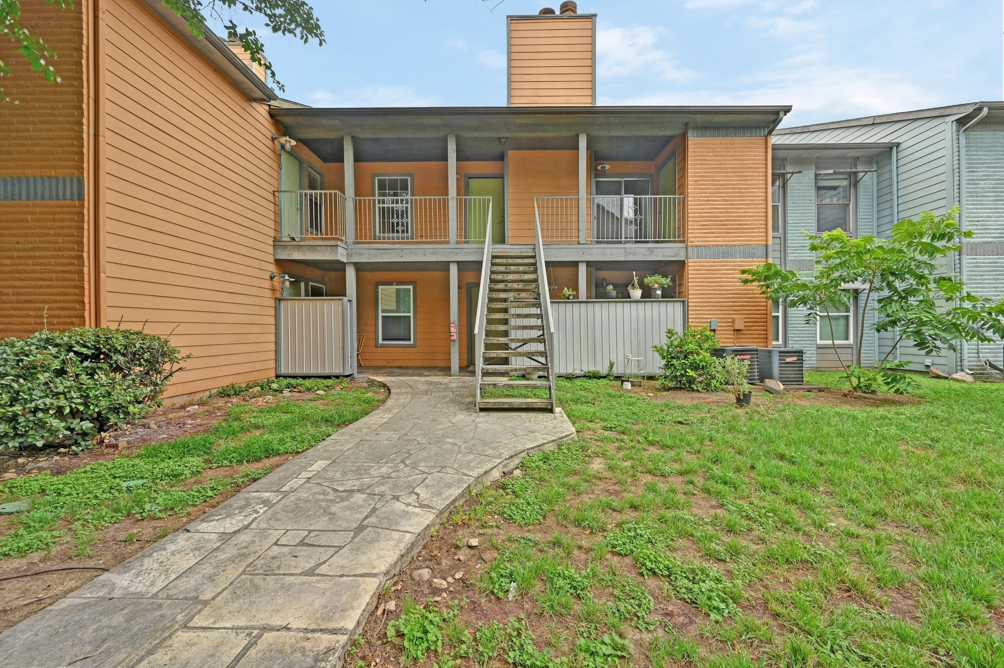 3204 Menchaca Road, Unit 212 Austin, TX 78704 - Photo 6 of 22 a front view of a house with garden