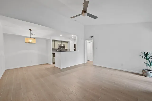 a view of a kitchen with a sink cabinets and window