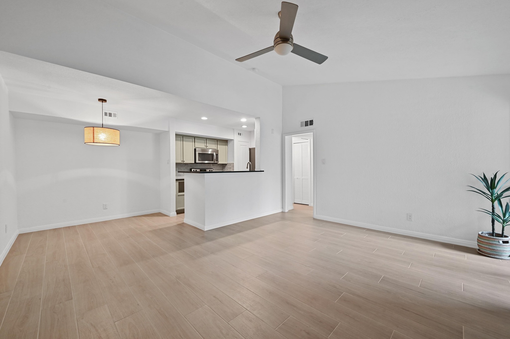 3204 Menchaca Road, Unit 212 Austin, TX 78704 - Photo 7 of 22 a view of a kitchen with a sink cabinets and window