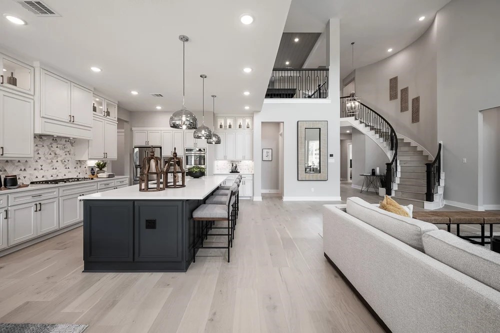 28514 Sandy Lk Drive Spring, TX 77386 - Photo 4 of 9 a large white kitchen with a large island oven a sink stainless steel appliances and cabinets