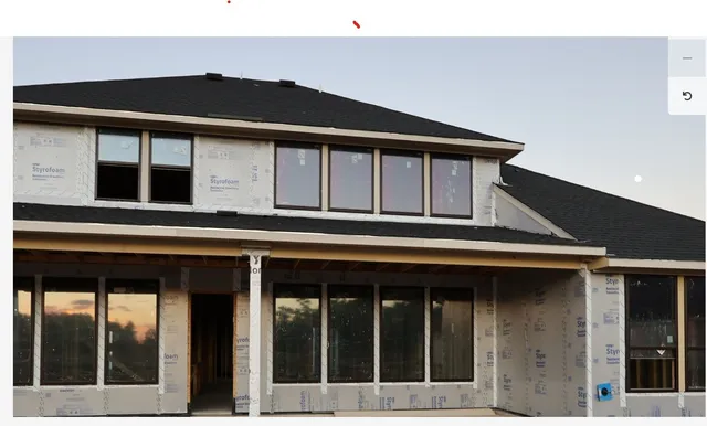 a front view of a house with glass windows