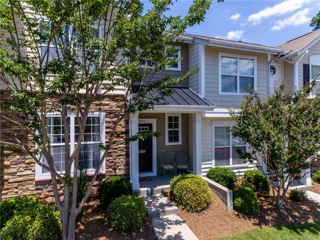 975 Copperstone Lane, Unit 975 Fort Mill, SC 29708 - Photo 1 of 23 a front view of a house with garden