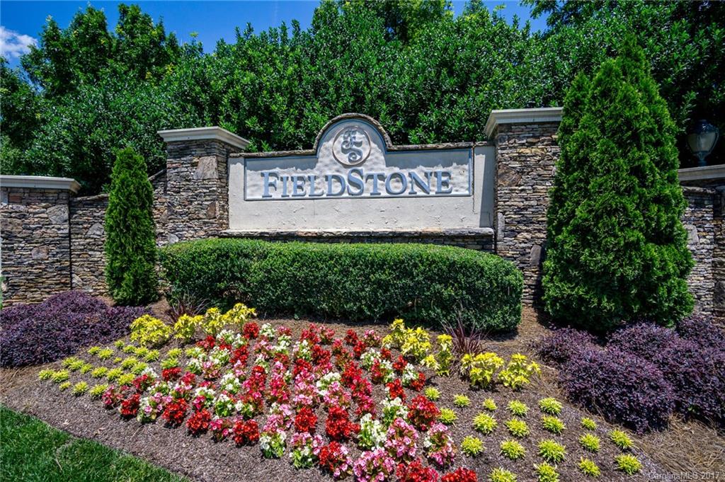 975 Copperstone Lane, Unit 975 Fort Mill, SC 29708 - Photo 2 of 23 a view of sign board with plants in the background