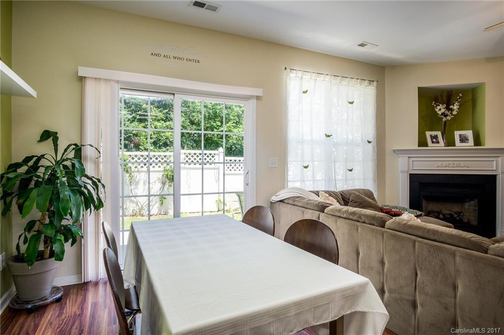 975 Copperstone Lane, Unit 975 Fort Mill, SC 29708 - Photo 11 of 23 a living room with furniture and a potted plant