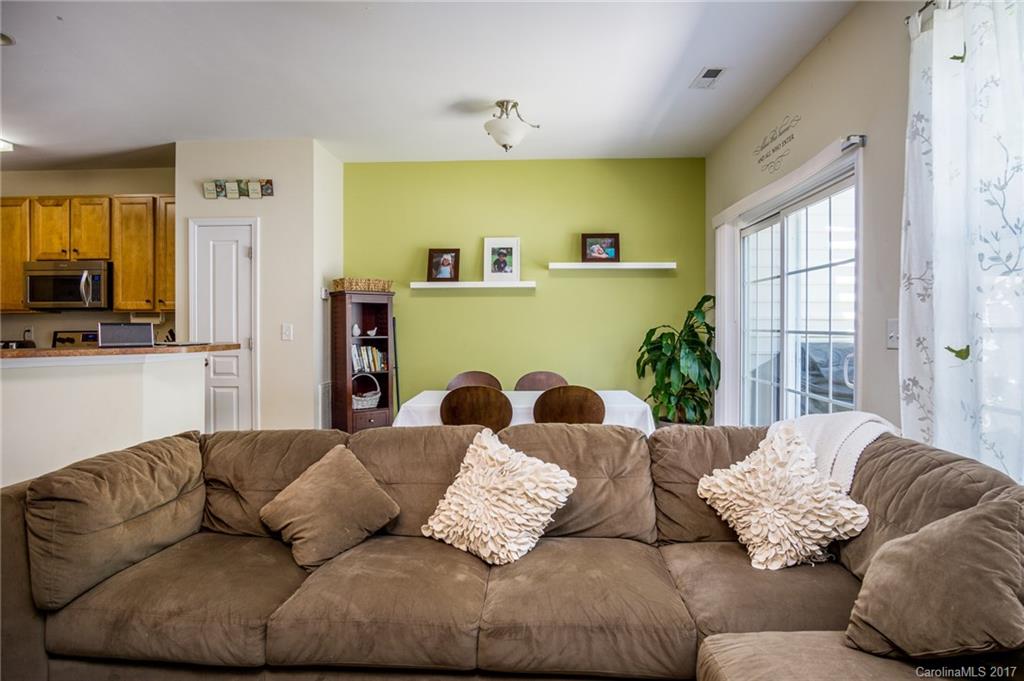 975 Copperstone Lane, Unit 975 Fort Mill, SC 29708 - Photo 12 of 23 a living room with fireplace furniture and a flat screen tv