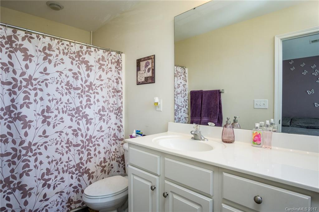 975 Copperstone Lane, Unit 975 Fort Mill, SC 29708 - Photo 16 of 23 a bathroom with a sink and a mirror