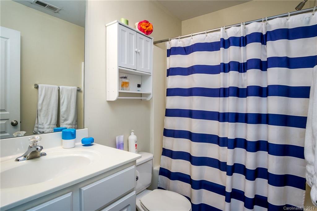 975 Copperstone Lane, Unit 975 Fort Mill, SC 29708 - Photo 18 of 23 a bathroom with a sink toilet and a mirror