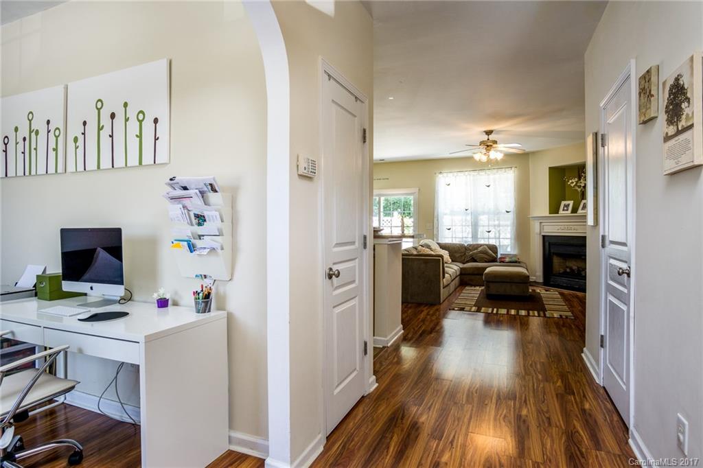 975 Copperstone Lane, Unit 975 Fort Mill, SC 29708 - Photo 3 of 23 a workspace with furniture and view of kitchen