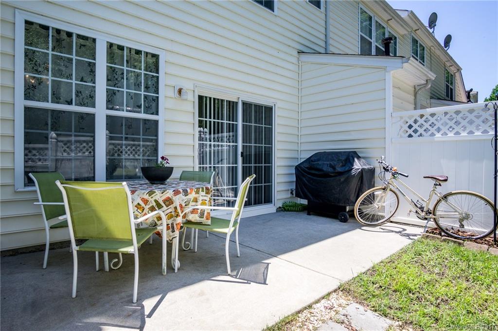 975 Copperstone Lane, Unit 975 Fort Mill, SC 29708 - Photo 21 of 23 a couple of chairs sitting in front of a house