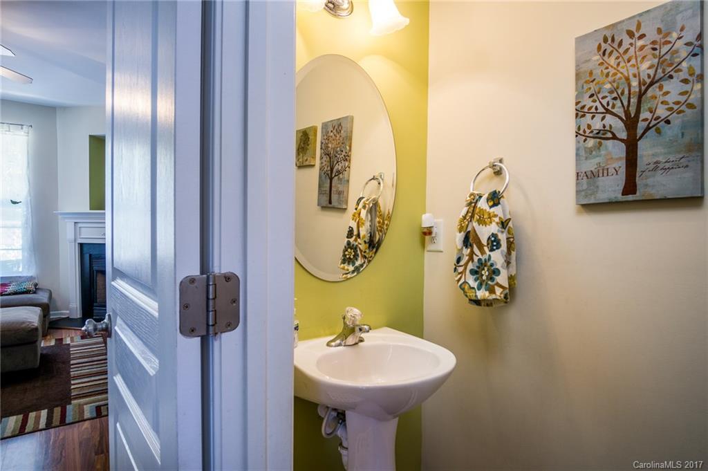 975 Copperstone Lane, Unit 975 Fort Mill, SC 29708 - Photo 6 of 23 a bathroom with a sink and mirror with toilet