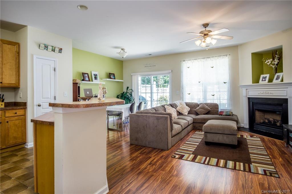 975 Copperstone Lane, Unit 975 Fort Mill, SC 29708 - Photo 7 of 23 a living room with furniture and a fireplace