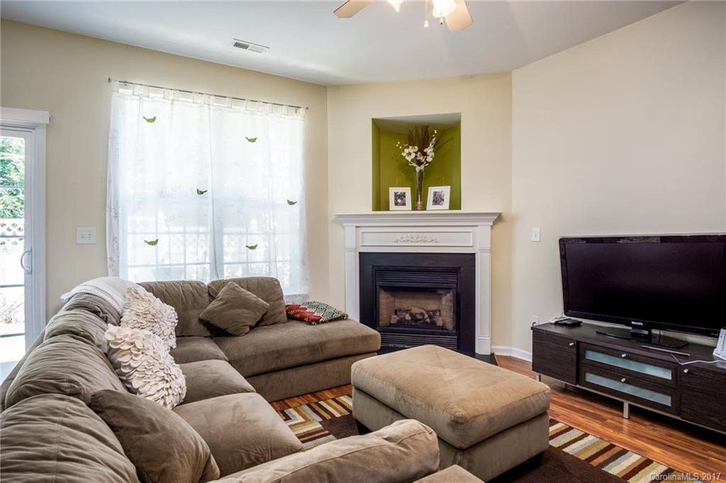 975 Copperstone Lane, Unit 975 Fort Mill, SC 29708 - Photo 8 of 23 a living room with furniture and a flat screen tv