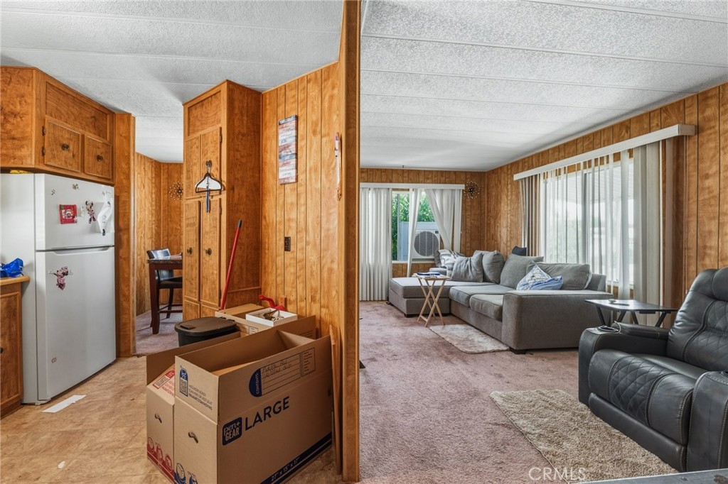 20683 Waalew Road, Unit B201 Apple Valley, CA 92307 - Photo 6 of 32 a living room with furniture and a large window