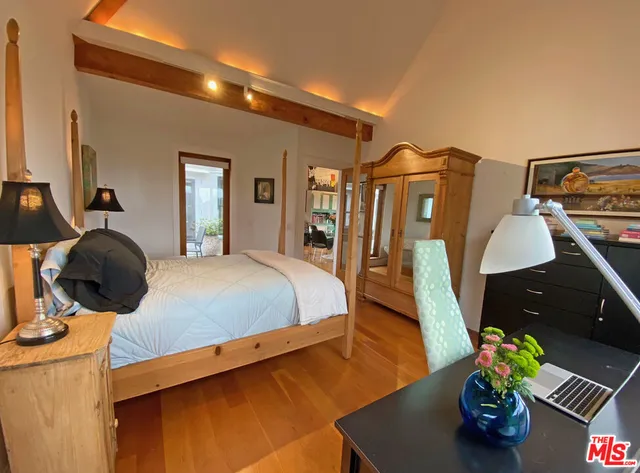 a view of a dinning table and chairs in patio of the house