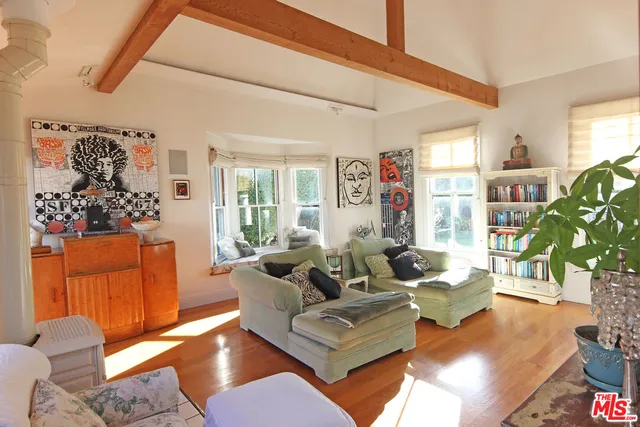 a view of a living room and kitchen