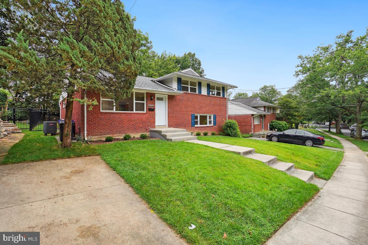 10307 Leslie Street Silver Spring, MD 20902 - Photo 2 of 46 a front view of house with yard and green space