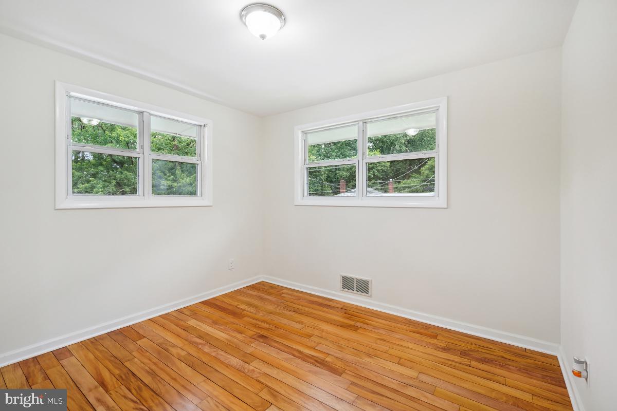 10307 Leslie Street Silver Spring, MD 20902 - Photo 22 of 46 an empty room with a window