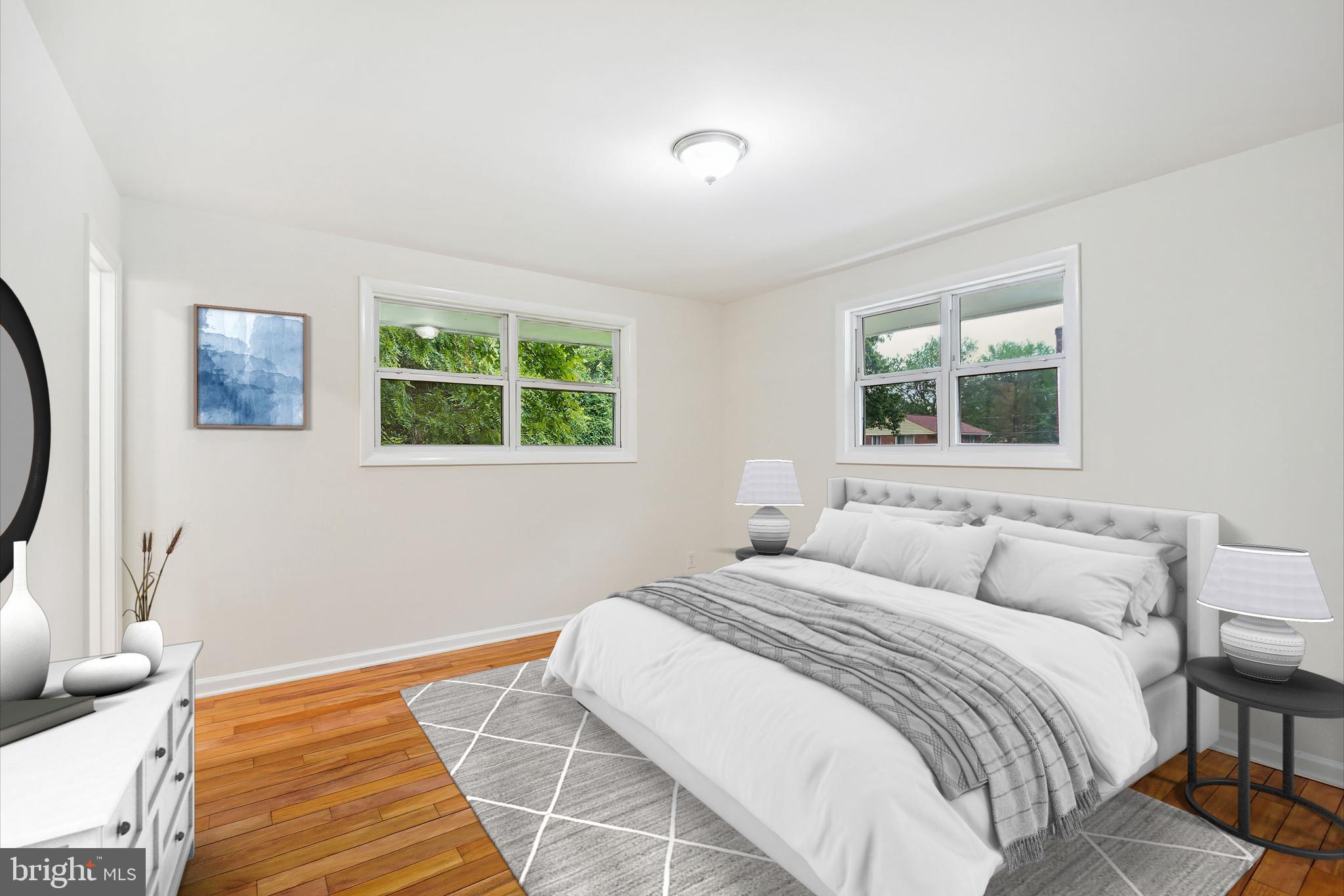 10307 Leslie Street Silver Spring, MD 20902 - Photo 24 of 46 a bedroom with a bed and a window