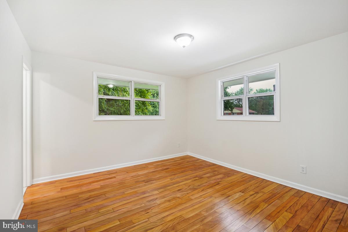 10307 Leslie Street Silver Spring, MD 20902 - Photo 25 of 46 a view of a room with wooden floor and a window