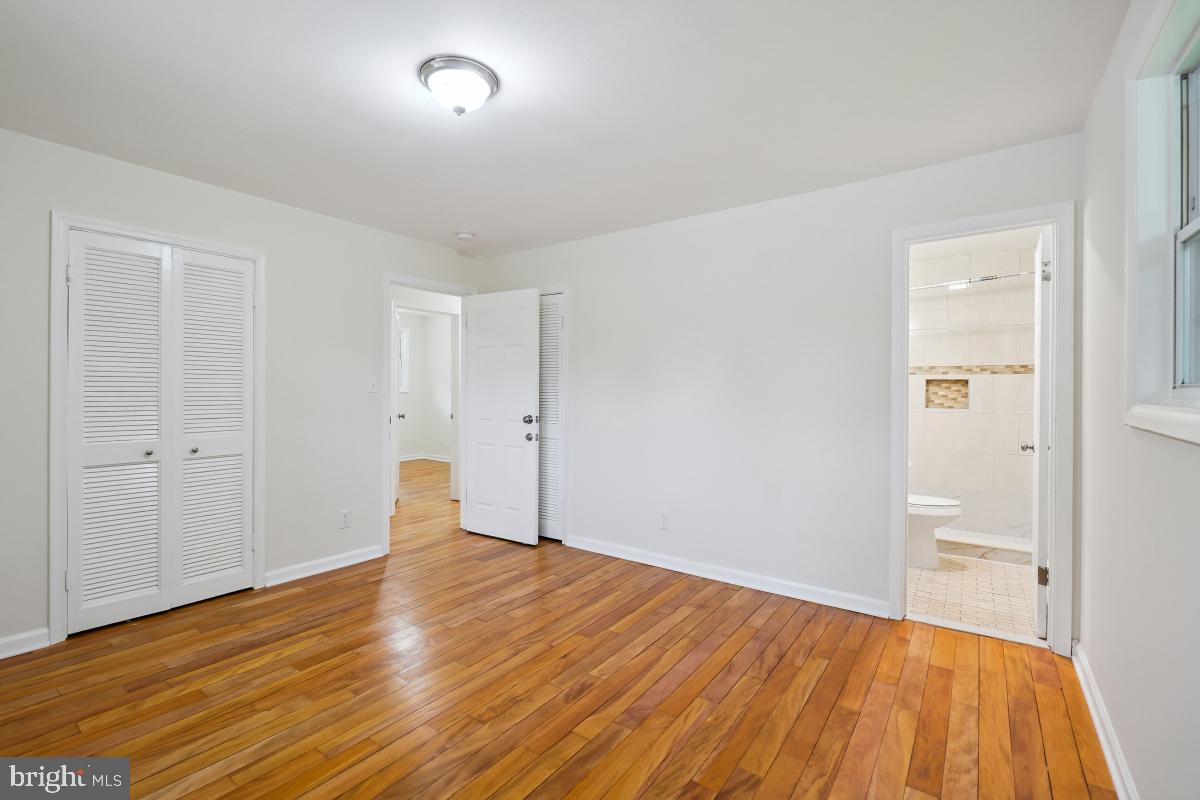 10307 Leslie Street Silver Spring, MD 20902 - Photo 26 of 46 a view of empty room with wooden floor