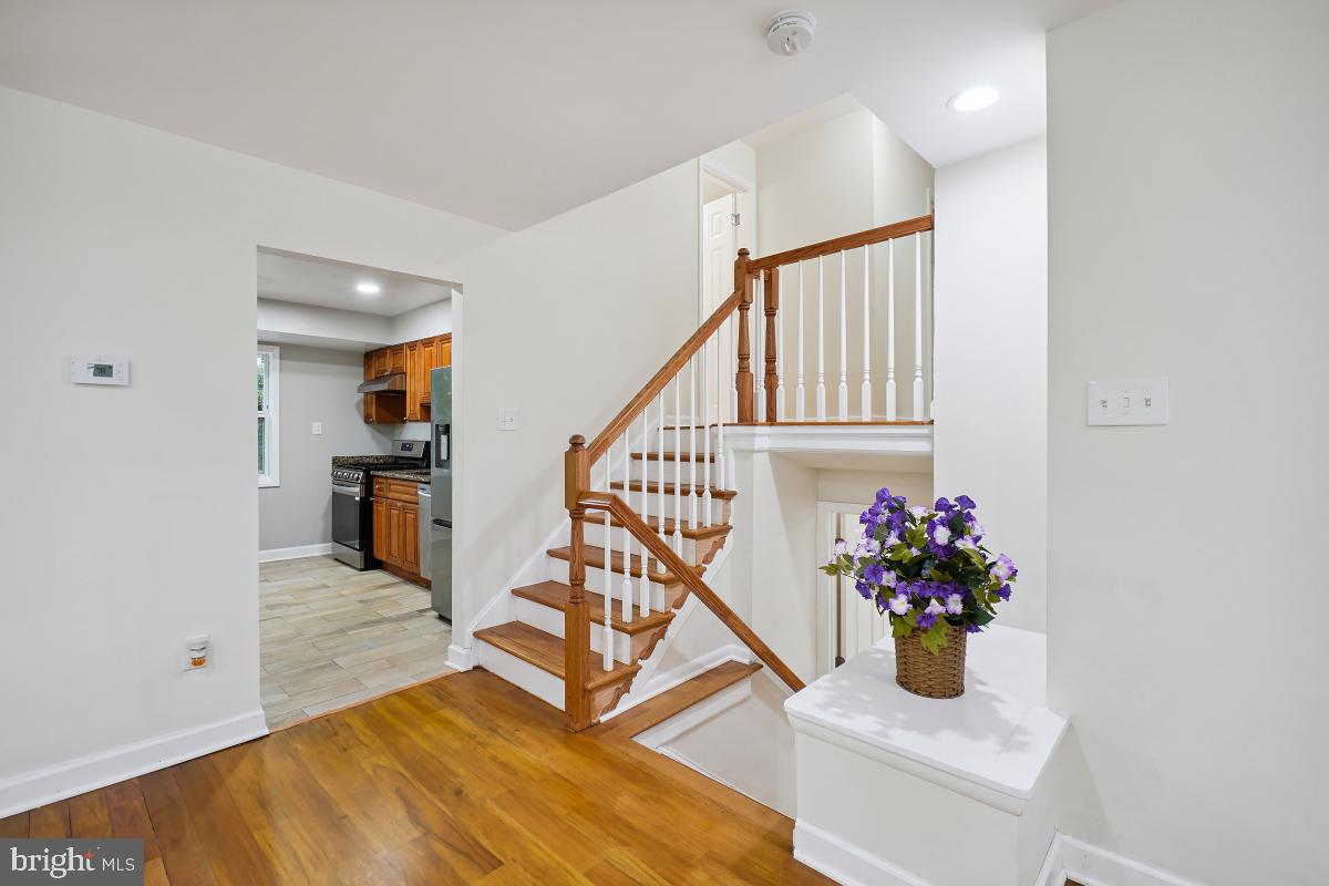 10307 Leslie Street Silver Spring, MD 20902 - Photo 29 of 46 a living room with stairs