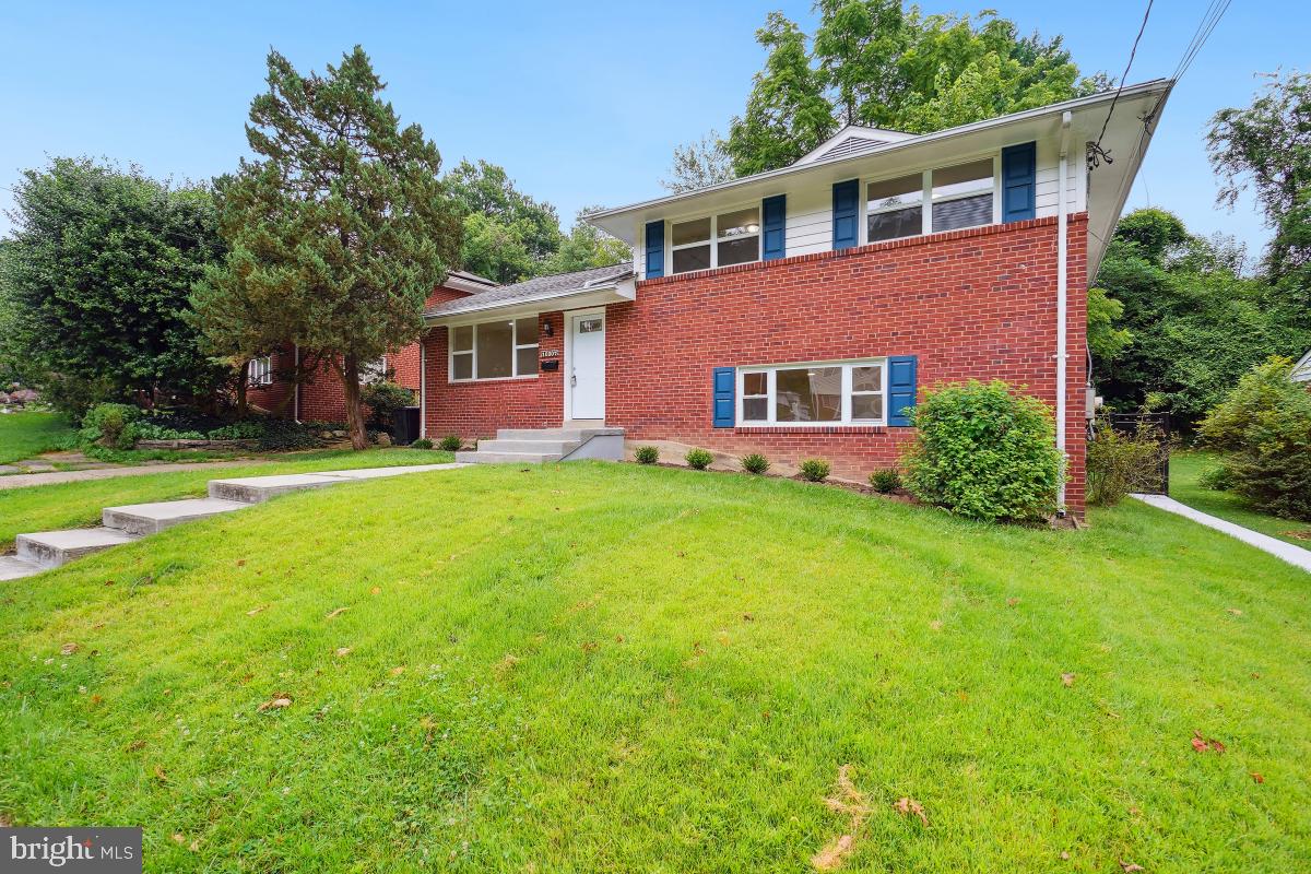 10307 Leslie Street Silver Spring, MD 20902 - Photo 3 of 46 front view of a house with a yard