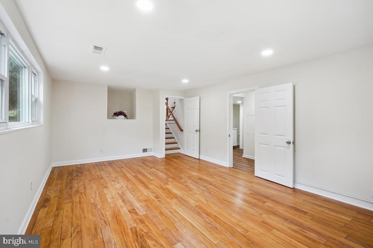 10307 Leslie Street Silver Spring, MD 20902 - Photo 31 of 46 a view of empty room with wooden floor